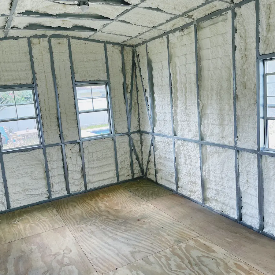 Closed-cell spray foam insulation applied to wall cavities in a residential project in Iowa City